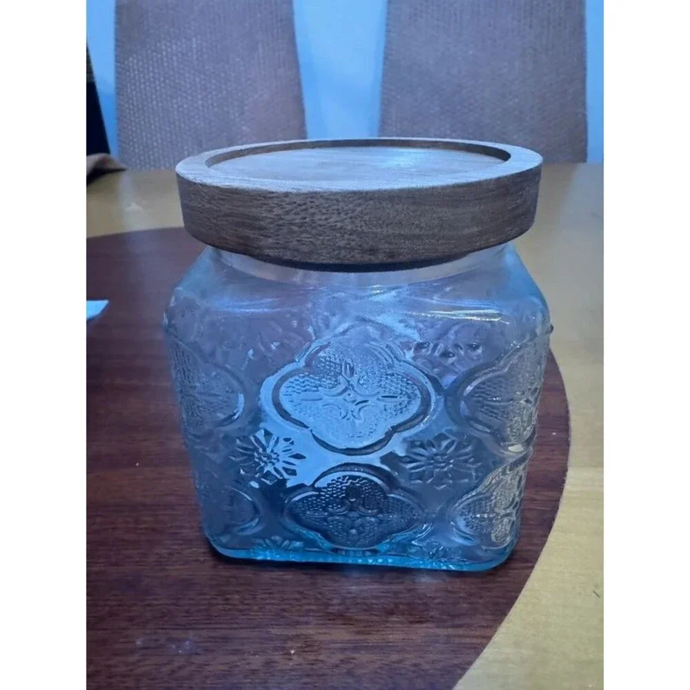 Embossed glass storage jar